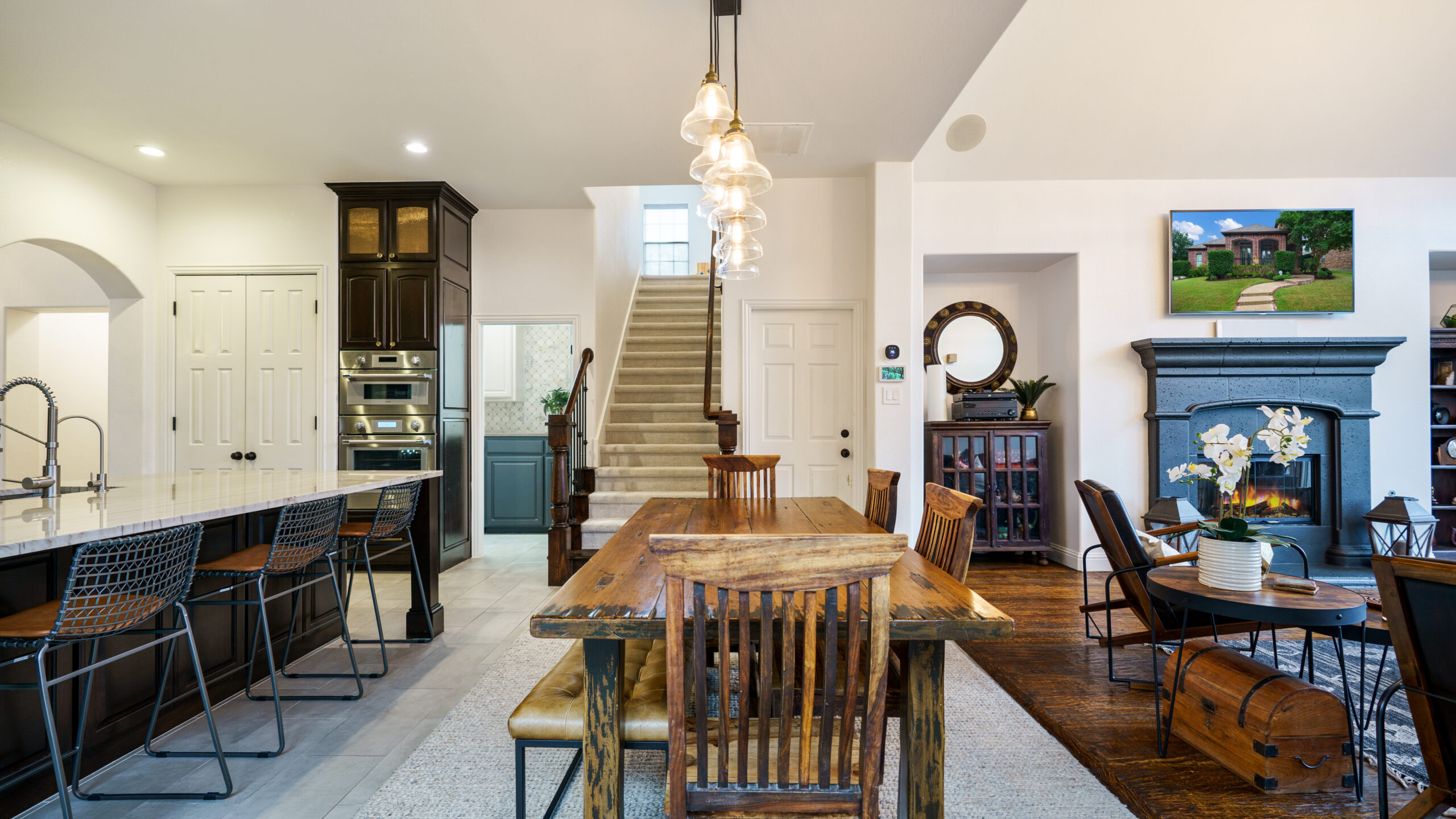 Open kitchen and dining area with a staircase