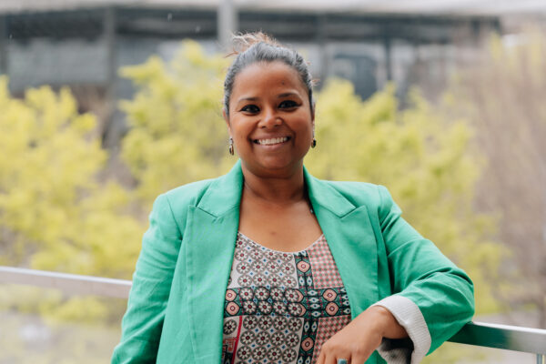 Branding portrait of a woman in a green blazer outdoors