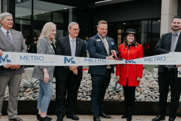 Ribbon cutting in front of a new office building