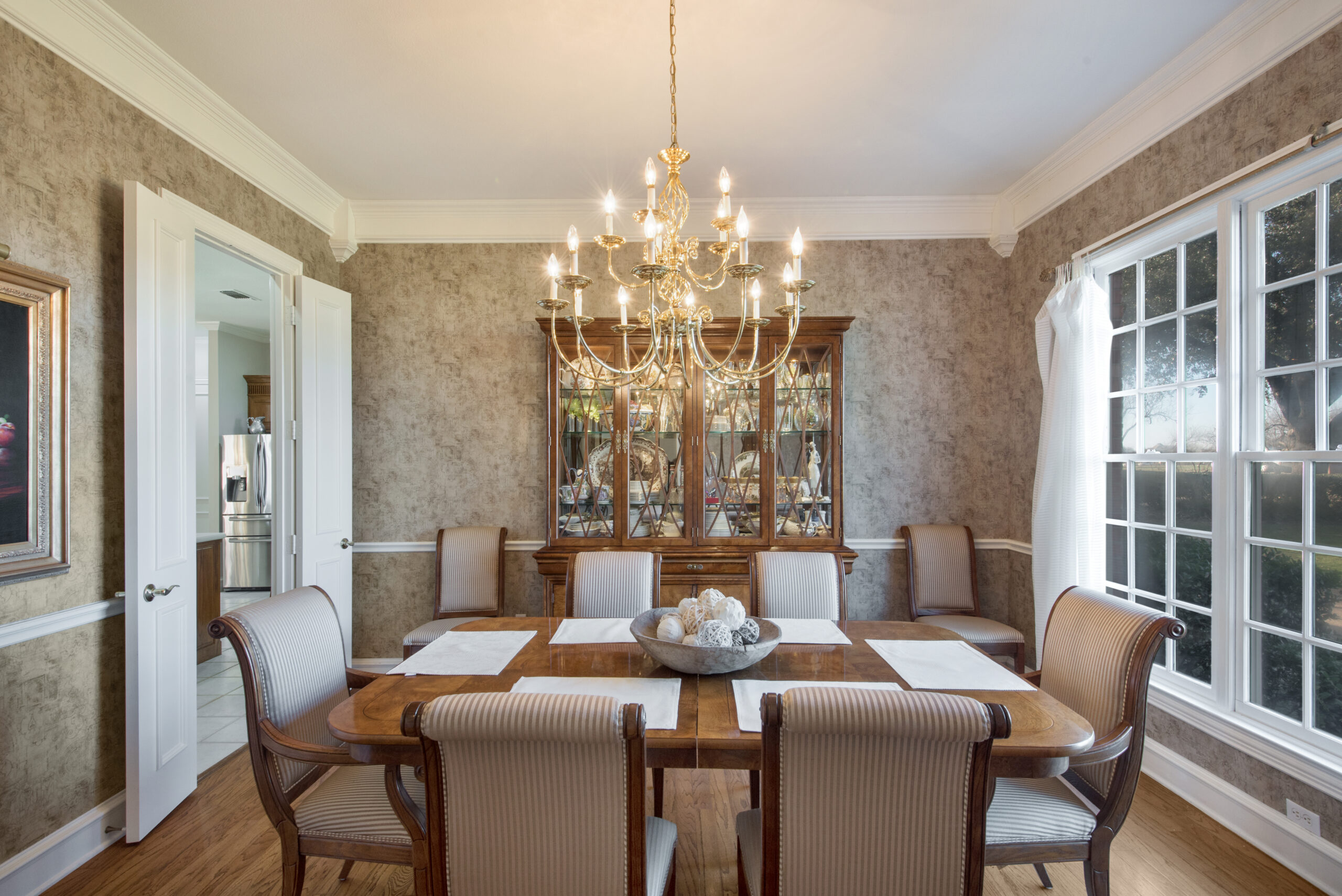 Formal dining room with a chandelier
