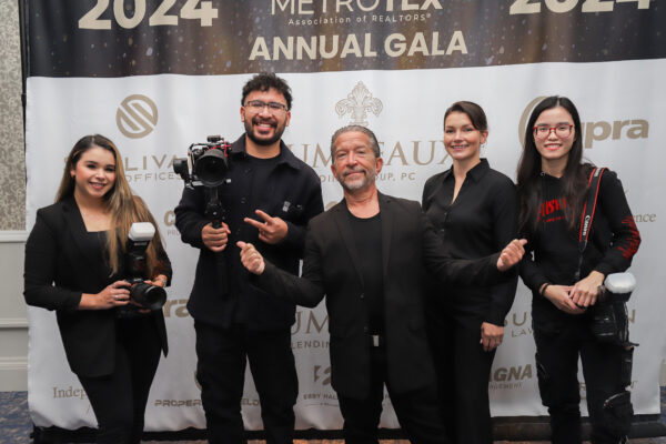 Media crew with cameras at an association annual gala