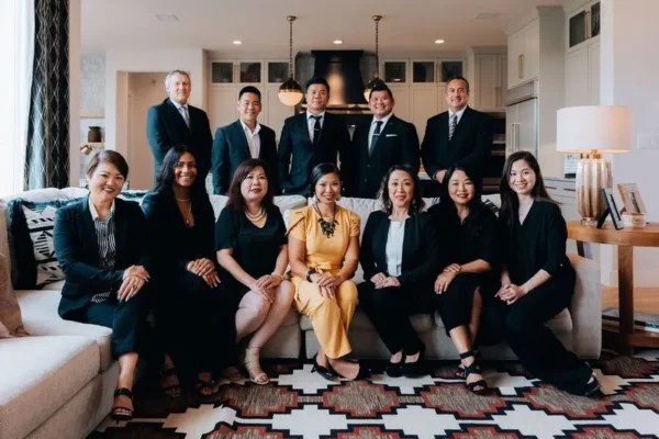 Real estate team portrait in a living room setting