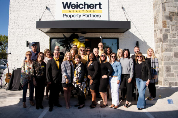 Real estate office team photo outside their office
