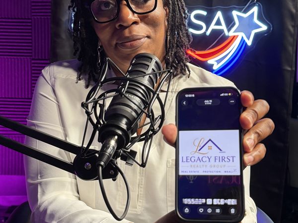 Guest holding her brand on screen at studioUSA East in Plano
